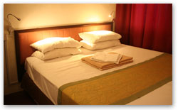 King's Family Room at Red Inn Court - spacious heritage room with king bed and warm lighting